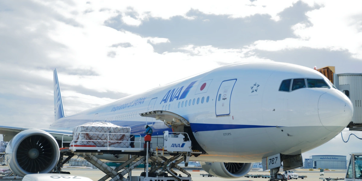 An airplane is being loaded with cargo